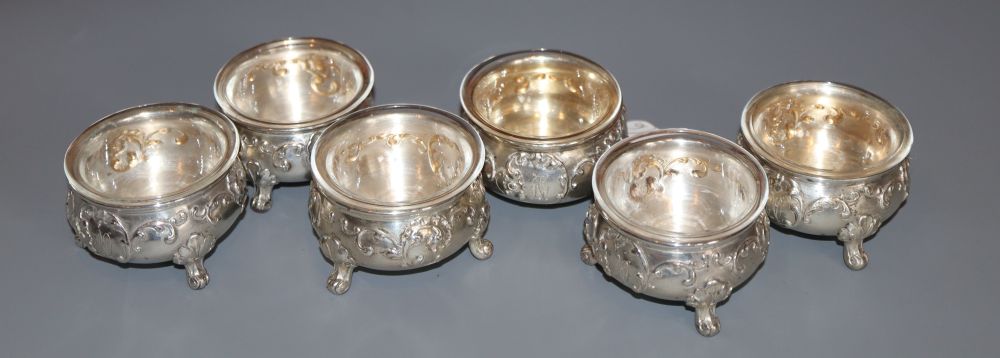 A set of six early 20th century Austrian 800 white metal salts, with clear glass liners, maker J.V, monogrammed,